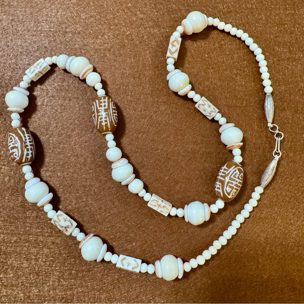 White and Brown Beaded Necklace with Decorative Elements